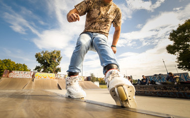 Roller riding in the park - obrazy, fototapety, plakaty