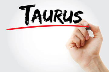 Hand writing Taurus with marker, concept background