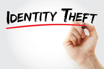 Hand writing Identity theft with marker, concept background