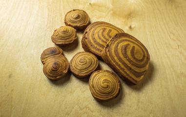 homemade cookies spiral on a light wooden background