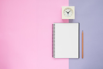 Top view of notebook pencil clock