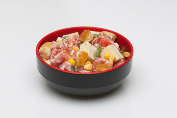 salad in a deep black cup