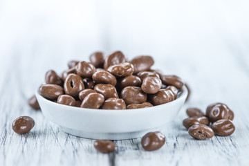 Old wooden table with Chocolate Raisins