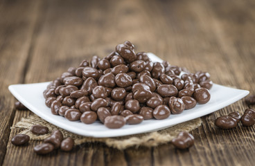 Old wooden table with Chocolate Raisins