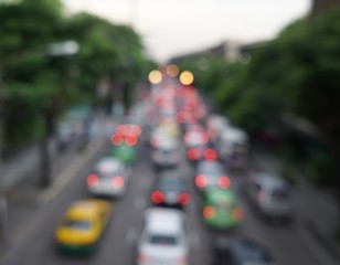 blur photo of bad traffic street in evening time with bokeh of light
