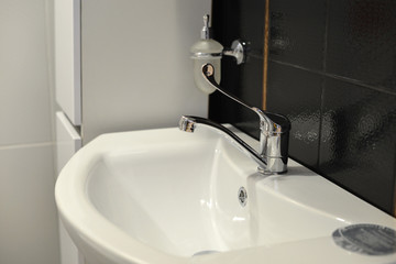 sink and faucet closeup, shallow depth of field