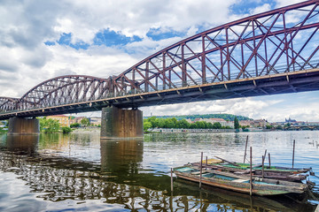 Fototapeta na wymiar old railway bridge over the Vltava River in Prague