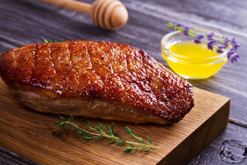 Duck breast, lavender honey and thyme, served on chopping board