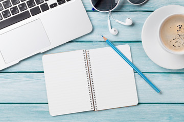 Desk with laptop, coffee and notepad