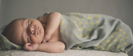 newborn baby laying down sleeping. © dizitsyn