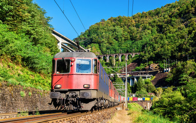 Obraz premium Freight train goes down the Gotthard pass - Switzerland