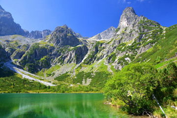 Beautiful summer landscape. Mountain lake Zelene pleso in National Park High Tatra. Slovakia, Europe.