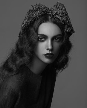 Portrait of woman wearing plants in hair