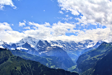 Panoramic view of the Alps in Switzerland on a hot summer day