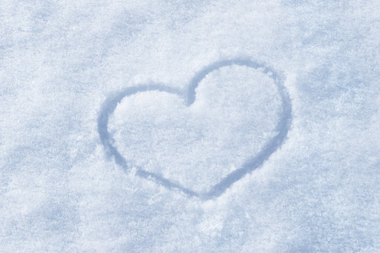 The shape of heart painted on the snow
