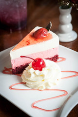 Strawberry cheesecake on wooden background