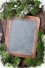 Christmas chalkboard and fir tree with snow