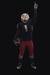 Football player on dark background