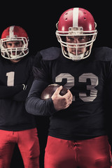 Football player on dark background