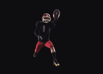 Football player on dark background