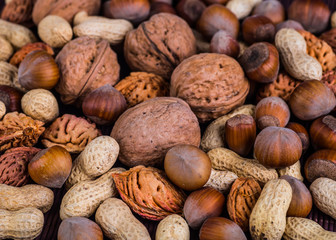 Nuts mix in a wooden plate