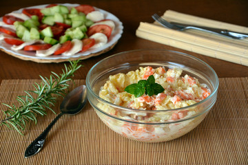 Homemade Potato Salad with Eggs and Carrots Decorated On A Glass Bowl