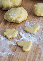 Homemade heart/flower shaped pastry on the wooden board