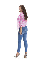 Young beautiful brunette woman in blue jeans