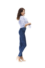 Young beautiful brunette woman in blue jeans