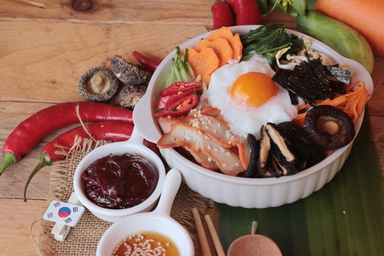 Bibimbap korean food is delicious on wood background.