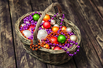 Christmas decoration in a basket on a wooden floor