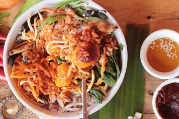 Bibimbap korean food is delicious on wood background.