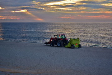 Beach Cleaning Operation at Sunrise