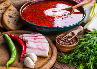 Ukrainian beetroot soup - borscht, on napkin, on wooden backgrou