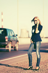 Fashion blond woman calling on the phone outdoor