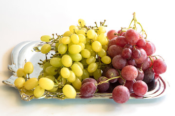 Red and Green Grapes on a silver plate