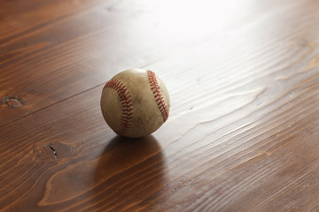 Selective focus vintage baseball on pine wood background