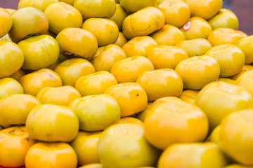 Yellow Persimmon sale at China town or Yaowarat Thailand.