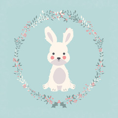 Cute baby bunny rabbit in Christmas flower and branch wreath