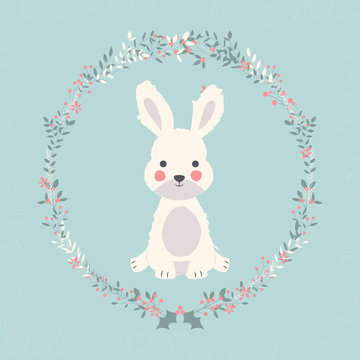 Cute baby bunny rabbit in Christmas flower and branch wreath