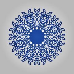 Die cut paper card with cutout mandala ornament.