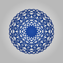 Die cut paper card with cutout mandala ornament.