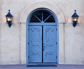 Dawn on blue doors of Albuquerque church