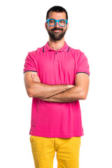 Man in colorful clothes with his arms crossed