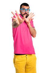 Frightened man with colorful clothes