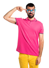Man with colorful clothes making crazy gesture