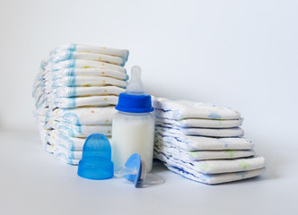 Two stacks of diapers on white background.