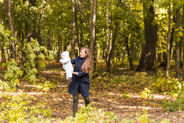 Fototapeta premium happy mother and baby outdoor in the autumn park