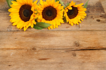 Sunflowers on rustic wood