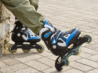 Roller skate legs close up in skatepark. Low section. Roller skates is extreme sport.